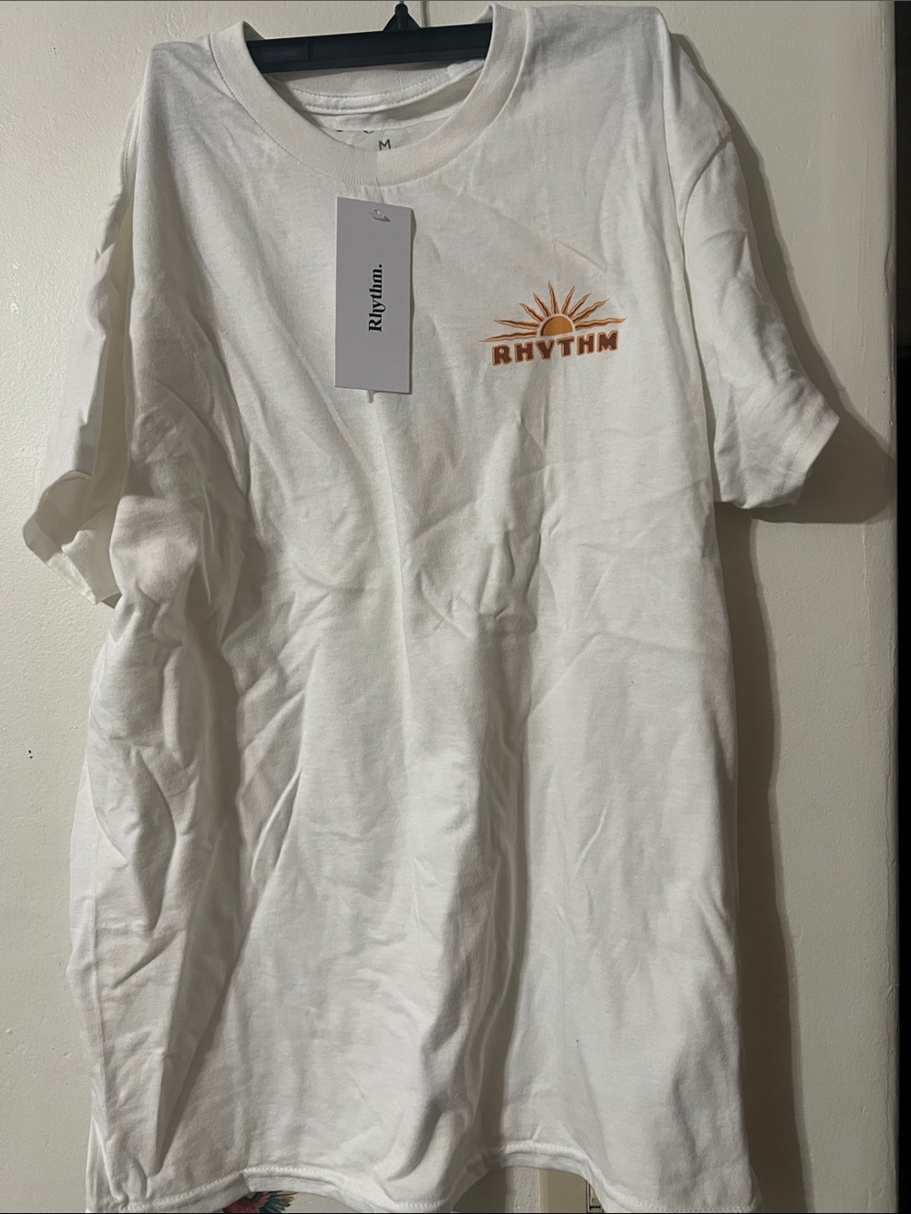 Size M..Rhythm. White Short-Sleeve Tee with Orange Sun Logo